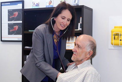 Dr. Miriam Vassallo consulting a patient at Breathe Well in Cleveland